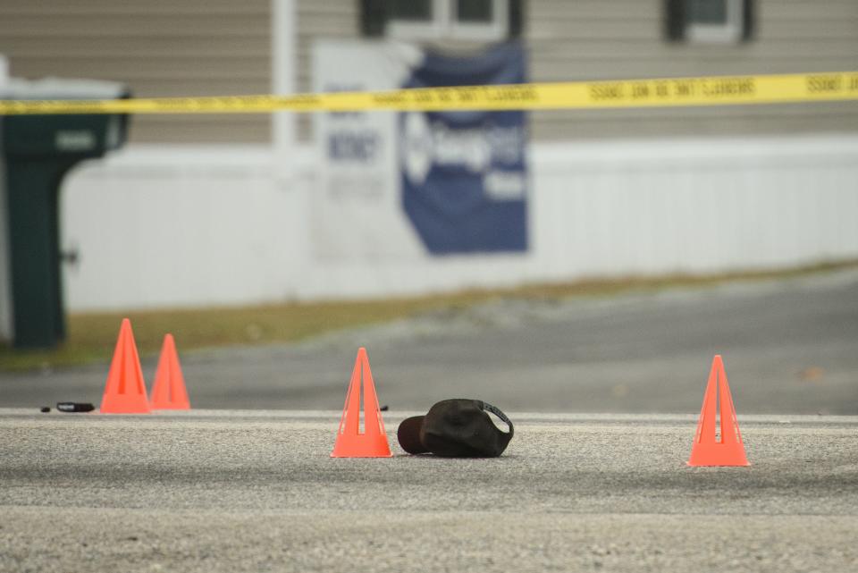 Orange cones mark evidence on Gillespie Street, where a Cumberland County Sheriff's Office Deputy was struck by a vehicle early Friday. The deputy died from their injuries at Cape Fear Valley Medical Center.