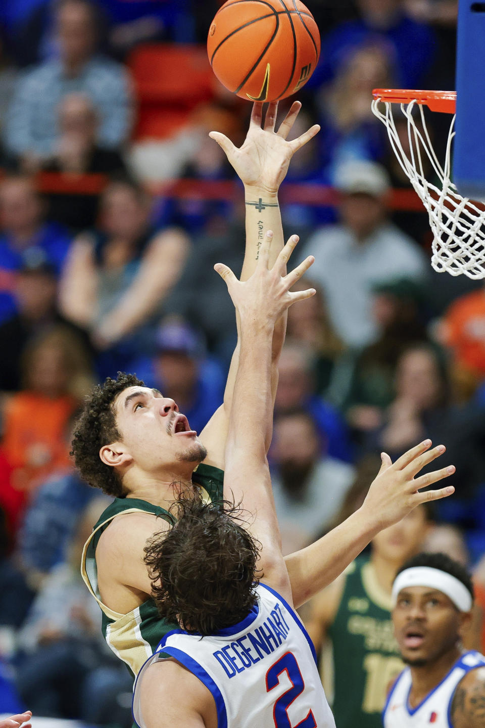 Colorado State forward Joel Scott shoots over Boise State forward Tyson Degenhart (2) during the first half of an NCAA college basketball game Tuesday, Jan. 9, 2024, in Boise, Idaho. (AP Photo/Steve Conner)