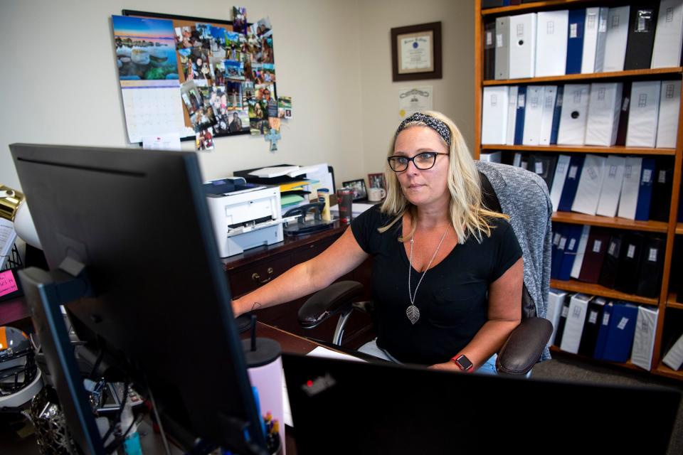 Paralegal Shannon Stan works at her desk at Kramer Rayson's downtown Knoxville office on Friday, June 3, 2022.