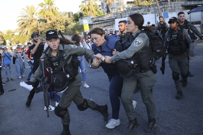 Israeli police arrest Al Jazeera journalist Givara Budeiri during a protest in east Jerusalem.