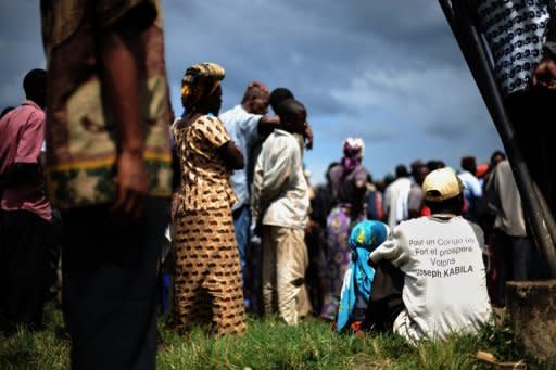 File photo of supporters of President Joseph Kabila at a rally in the Congolese north east town of Rutshuru. Rival supporters clashed Monday in the Democratic Republic of Congo where the government also shut down an opposition TV station, as tension rose with general polls only three weeks away