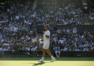 Spain's Fernando Verdasco celebrates after beating Britain's Kyle Edmund in a Men's singles match during day three of the Wimbledon Tennis Championships in London, Wednesday, July 3, 2019. (AP Photo/Tim Ireland)