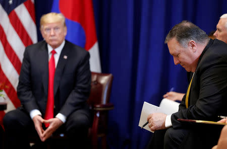 U.S. President Donald Trump and U.S. Secretary of State Mike Pompeo listen to a question during a bilateral meeting with South Korean President Moon Jae-in on the sidelines of the 73rd United Nations General Assembly in New York, U.S., September 24, 2018. REUTERS/Carlos Barria/Files