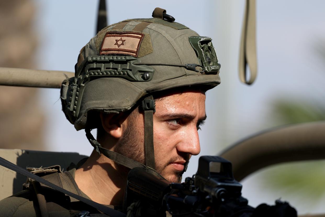 An Israeli soldier keeps watch at a position near the Israel-Gaza border (EPA)