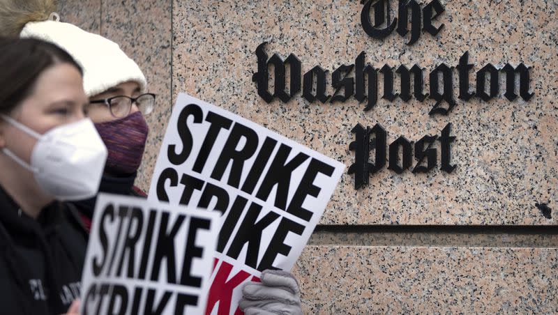 Employees of the Washington Post picket outside the company’s offices in downtown Washington, Thursday, Dec. 7, 2023. Dozens of employees joined the protest on Thursday as hundreds of Washington Post workers were expected to walk off the job amid a one-day strike over labor issues.