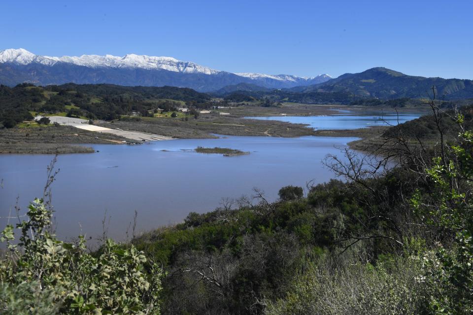 Snowy mountains overlook Lake Casitas in the Ojai Valley last March.