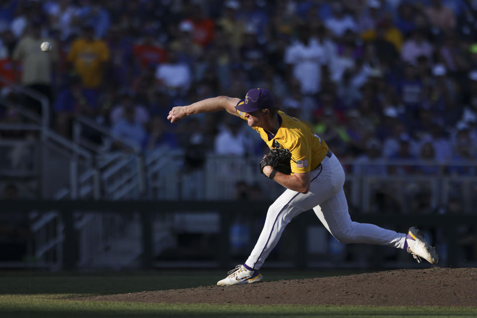 LSU pitcher Thatcher Hurd (26) throws in the second inning of Game 3 of the NCAA College World Series baseball finals against Florida in Omaha, Neb., Monday, June 26, 2023. (AP Photo/Rebecca S. Gratz)