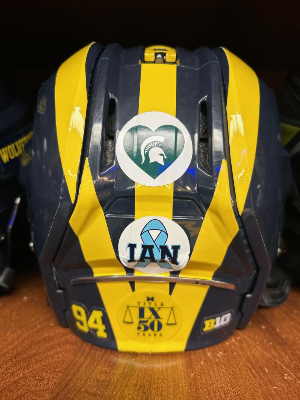 Some of the University of Michigan's athletic teams will wear special helmet decals to honor the victims at Michigan State.