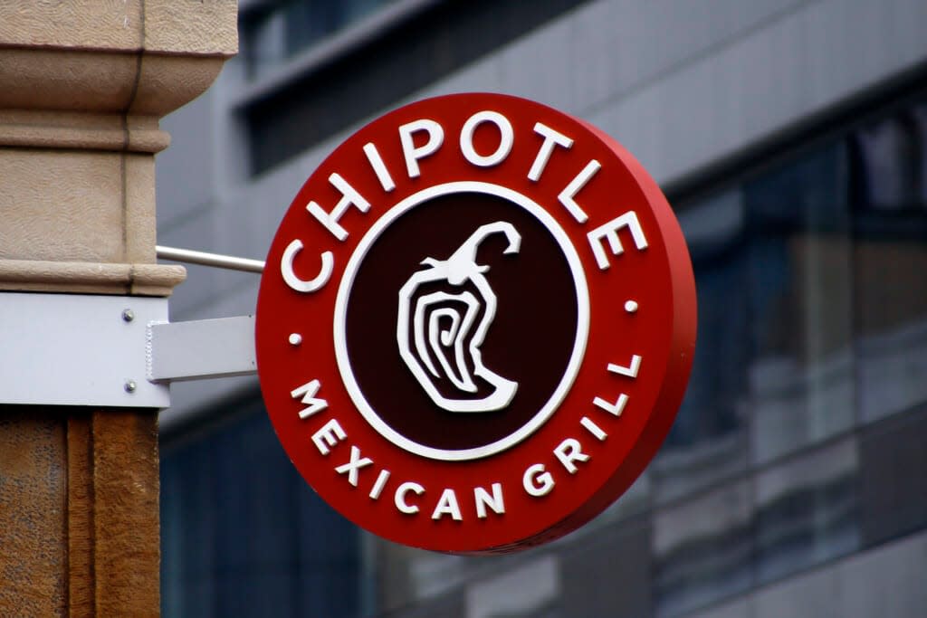A Chipotle sign hangs outside the chain restaurant in Pittsburgh on Feb. 8, 2016. (AP Photo/Keith Srakocic, File)