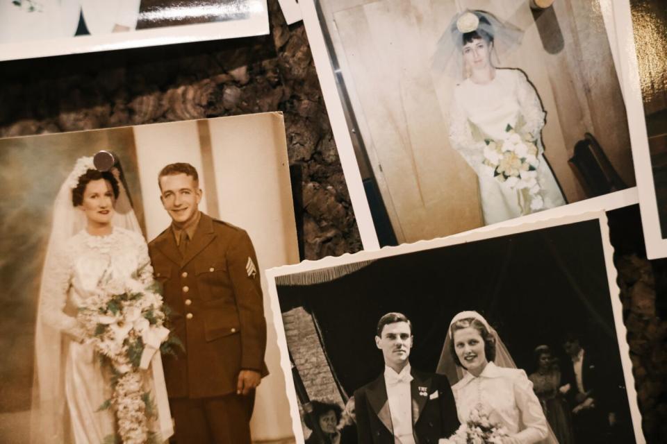 Vintage wedding pictures hang in the main office at the Old Brown House.