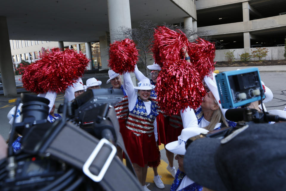 Kathi Schmeling, center, raises a pompom with other members of the Milwaukee Dancing Grannies before a performance at Aurora St. Luke’s Hospital in Milwaukee on Thursday, Sept. 3, 2022. As a way of saying “thank you,” the Grannies performed for a neurosurgeon and other medical staff who helped save and rehabilitate Betty Streng, a member of the Dancing Grannies who sustained a serious brain injury when the driver of an SUV struck her and dozens of others at a Christmas parade in Waukesha, Wis., last November. Six people were killed, including three Grannies and one group member’s husband. (AP Photo/Martha Irvine)