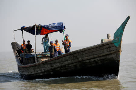 Bangladesh coast guards patrol in a vessel, near the Thengar Charan island in the Bay of Bengal, Bangladesh, February 2, 2017. Picture taken February 2, 2017. REUTERS/Mohammad Ponir Hossain