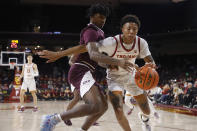 Southern California guard Boogie Ellis, right, drives past Eastern Kentucky guard Dashawn Jsckson during the first half of an NCAA college basketball game Tuesday, Dec. 7, 2021, in Los Angeles. (AP Photo/Ringo H.W. Chiu)