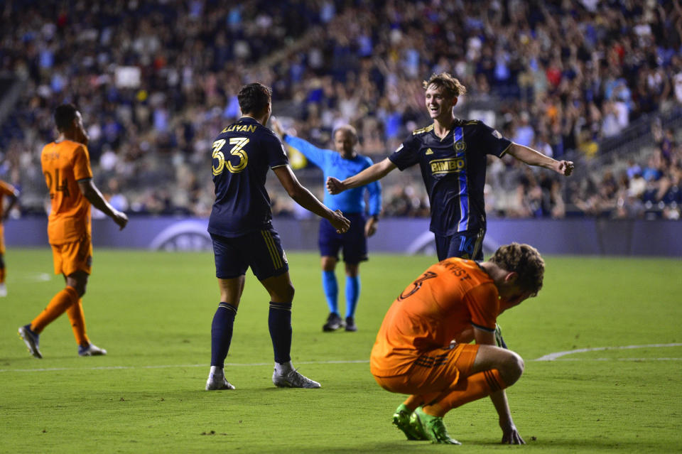 Philadelphia Union's Quinn Sullivan (33) celebrates with Jack McGlynn, upper right, after scoring a goal during the second half of an MLS soccer match against the Houston Dynamo, Saturday, July 30, 2022, in Chester, Pa. (AP Photo/Derik Hamilton)