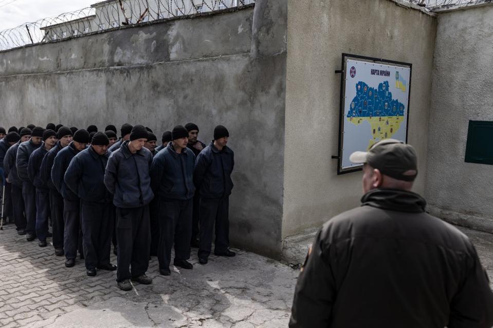 A group of Russian soldiers captured during the Russian invasion of Ukraine lined up in a prison in western Ukraine on April 18, 2023. (Diego Herrera Carcedo/Anadolu Agency via Getty Images)