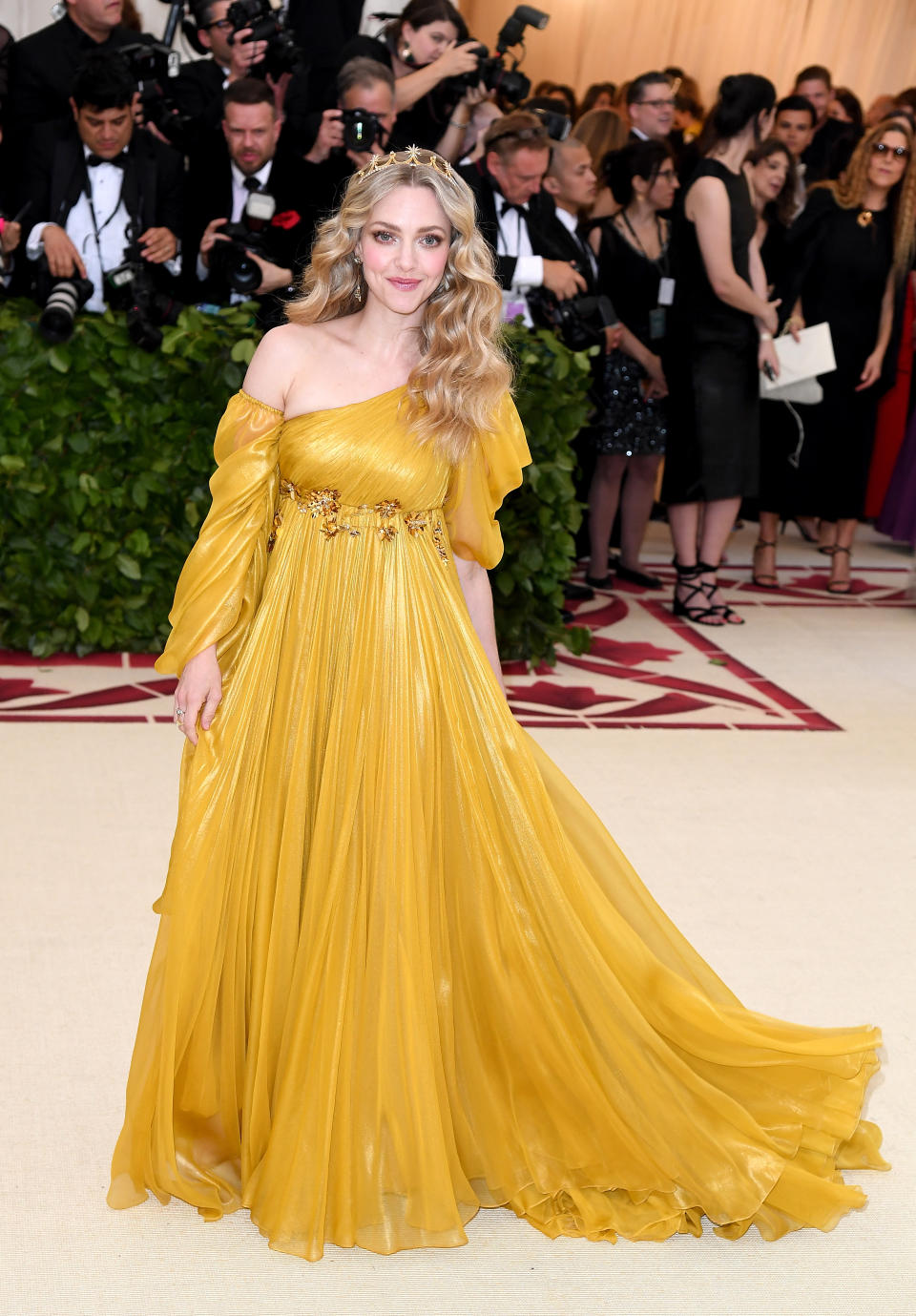 <p>We can’t decided whether or not Amanda Seyfried looks like a Disney princess or the sun in this Prada gown but we love it either way. Photo: Getty Images </p>