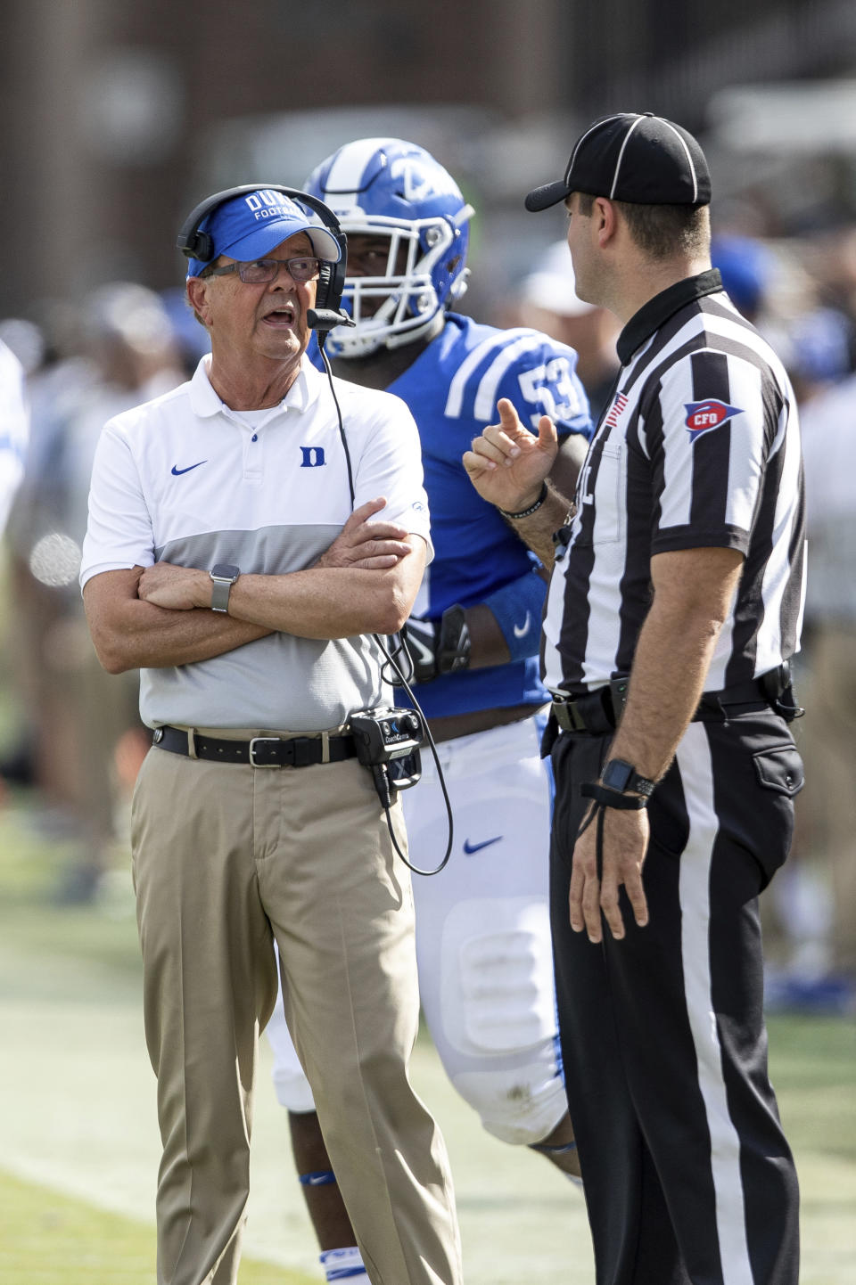 Duke head coach David Cutcliffe, left, speaks with an official during an NCAA college football game against Georgia Tech in Durham, N.C., Saturday, Oct. 12, 2019. (AP Photo/Ben McKeown)