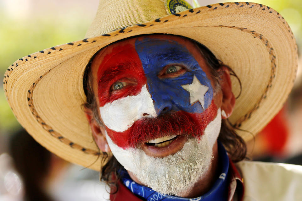 <p>Marcos Spence solicits volunteers to work for the campaign of Republican presidential candidate Donald Trump as they stand in line before the start of his rally in Albuquerque, N.M., Tuesday, May 24, 2016. (Reuters/Jonathan Ernst) </p>