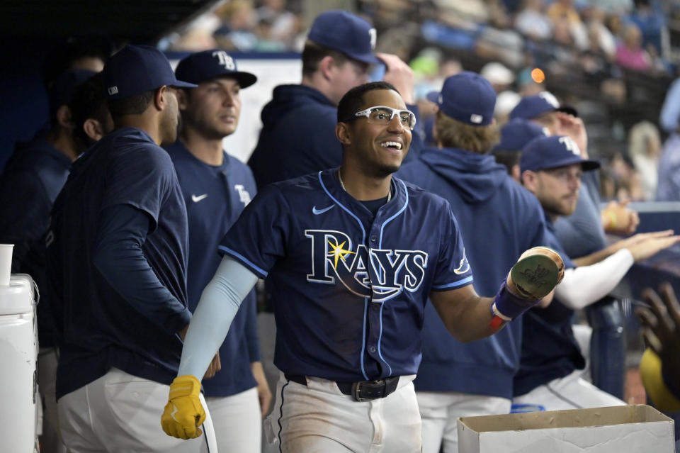 Tampa Bay Rays' Richie Palacios celebrates in the dugout after scoring on a wild pitch by Seattle Mariners reliever Tayler Saucedo during the fourth inning of a baseball game Monday, June 24, 2024, in St. Petersburg, Fla. (AP Photo/Steve Nesius)