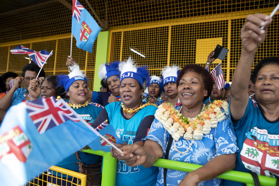 Local Fijian women wait for the arrival of Meghan, Duchess of Sussex at a market in Suva, Fiji, Wednesday, Oct. 24, 2018. Prince Harry and his wife Meghan are on day nine of their 16-day tour of Australia and the South Pacific. (Ian Vogler/Pool Photo via AP)