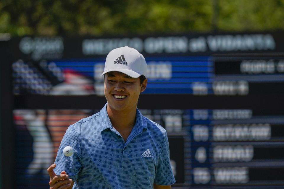 Brandon Wu, of the United States, tosses his golf ball at the 17th hole during the final round of the Mexico Open at Vidanta in Puerto Vallarta, Mexico, Sunday, May 1, 2022. (AP Photo/Eduardo Verdugo)