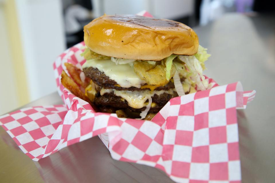 Vick's Ultimate Burger is the restaurant's signature hamburger. It contains four patties, grilled tomatoes, grilled onions, grilled jalapeños, fried pickles, bacon, American cheese, Swiss cheese, mustard, ketchup, mayo and lettuce.