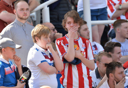 Soccer Football - Premier League - Stoke City vs Crystal Palace - bet365 Stadium, Stoke-on-Trent, Britain - May 5, 2018 Stoke City fans look dejected. REUTERS/Peter Powell