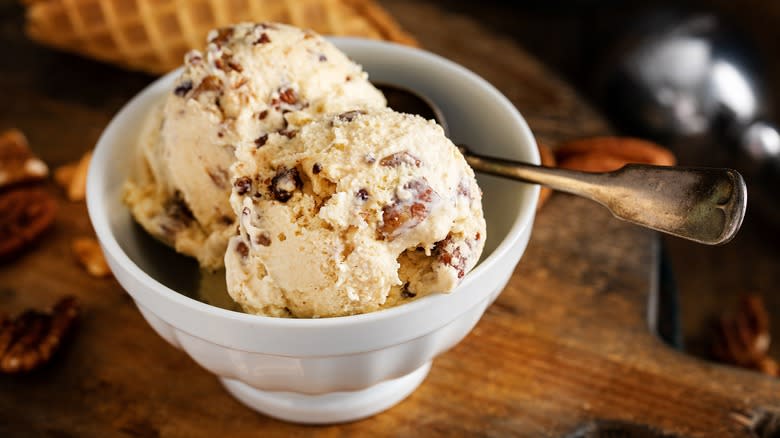 bowl of ice cream with mix-ins and a spoon