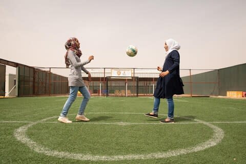 Sisters Rama, 15, and 18-year-old Hiba (right) take part in the Save the Children Coaching for Life programme in Jordan's Zaatari Syrian refugee camp - Credit: Save The Children