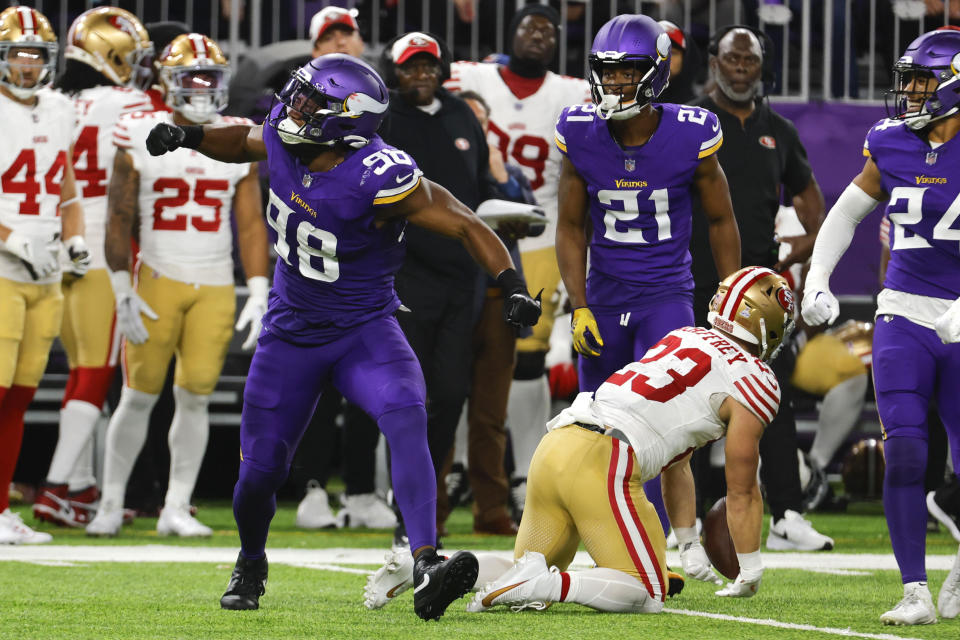 Minnesota Vikings linebacker D.J. Wonnum (98) celebrates after tackling San Francisco 49ers running back Christian McCaffrey (23) during the second half of an NFL football game, Monday, Oct. 23, 2023, in Minneapolis. (AP Photo/Bruce Kluckhohn)