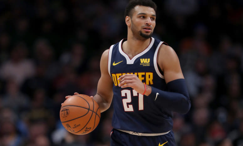 Jamal Murray dribbling up the floor for the Denver Nuggets.