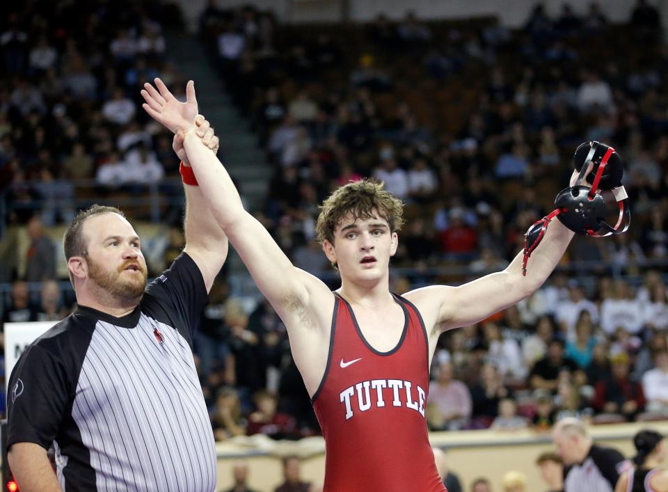 Tuttle's Ethan Teague celebrates his win over Skiatook's Josey Jernegan in the Class 4A 157-pound match during the state wrestling tournament Saturday at State Fair Arena.