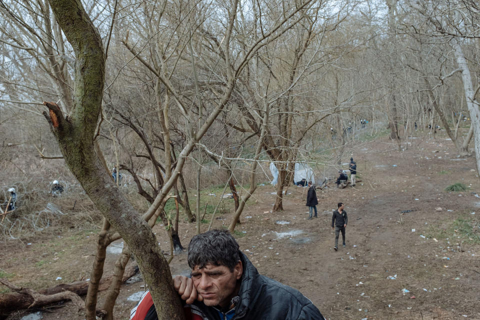 Muhammed, who fled Syria three years ago and was living in the Turkish port city of Mersin, rests against a tree. | Emin Ozmen—Magnum Photos for TIME
