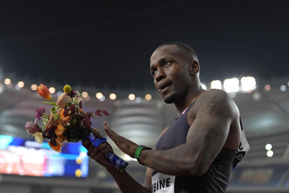 Akani Simbine of South Africa celebrates after winning the gold in the men's 100-meters final during the Diamond League event held in Suzhou in eastern China's Jiangsu province Saturday, April 27, 2024. (AP Photo/Ng Han Guan)