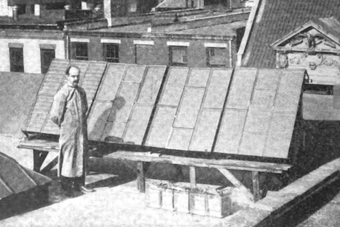 <span class="caption">George Cove stands next to his third solar array.</span> <span class="attribution"><a class="link " href="https://www.lowtechmagazine.com/2021/10/how-to-build-a-low-tech-solar-panel.html" rel="nofollow noopener" target="_blank" data-ylk="slk:Popular Electricity Magazine, April 1910 / Low Tech Magazine;elm:context_link;itc:0;sec:content-canvas">Popular Electricity Magazine, April 1910 / Low Tech Magazine</a></span>