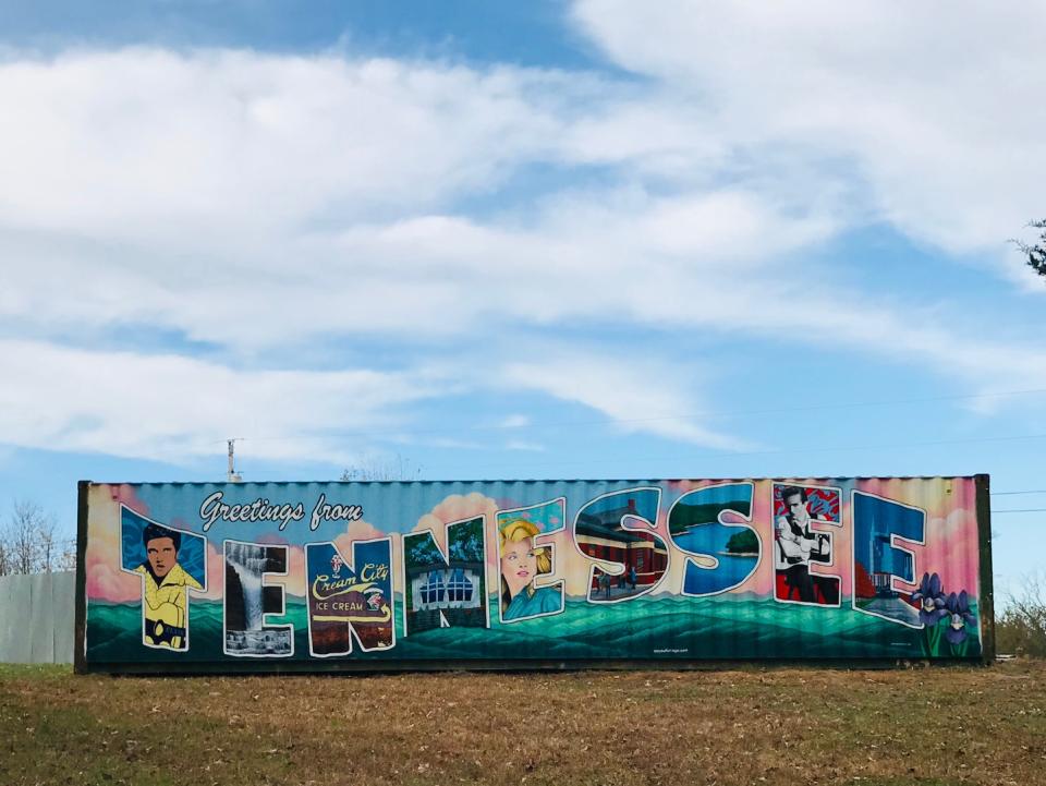 The owners commissioned a local mural artist, Erica Swenson, to paint their shipping container-turned-toolshed like a ‘60s postcard. Photo credit: Susan Dyer.