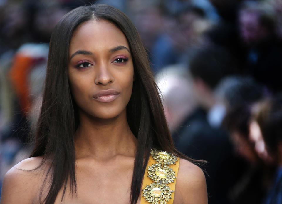 Model Jourdan Dunn wears a design created by Burberry Prorsum during London Fashion Week Spring/Summer 2014, at Kensington Gardens, central London, Monday, Sept. 16, 2013. (Photo by Joel Ryan/Invision/AP)