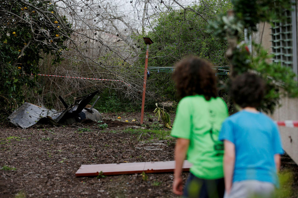 <p>Kids look at fragments of a Syrian anti-aircraft missile found in Alonei Abba, about 2 miles (3.2 km) from where the remains of a crashed F-16 Israeli war plane were found, at the village of Alonei Abba, Israel, Feb. 10, 2018. (Photo: Ronen Zvulun/Reuters) </p>