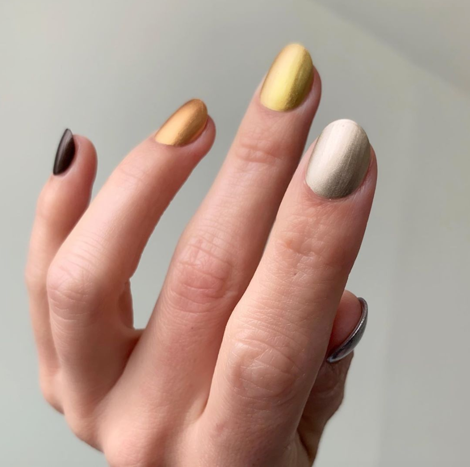 Another good option for the minimalists out there. Nail artist Stephanie Stone used Essie in <a href="https://www.amazon.com/essie-polish-seeing-stars-shimmer/dp/B075FJS2YZ" rel="nofollow noopener" target="_blank" data-ylk="slk:Seeing Stars;elm:context_link;itc:0;sec:content-canvas" class="link ">Seeing Stars</a>, <a href="https://cna.st/affiliate-link/428C3oXt2rzkDZs6XgNgJuuac1g7WSn8cLbaq6XoNBU2bwzWPCziUzj7awDpkeXuu24VJbVDpw1HK4jx7aNrwBD74BWSnmAXrg5ySJuwo8pRC7wPVZoAgvrjK1rZcEjU4uM8oscBMWZ67?cid=59d53c46240b1e16740eaf95" rel="nofollow noopener" target="_blank" data-ylk="slk:Pep in Your Rep;elm:context_link;itc:0;sec:content-canvas" class="link ">Pep in Your Rep</a>, <a href="https://www.amazon.com/Essie-Million-Mile-Hues-0-5/dp/B07K7VN1VB" rel="nofollow noopener" target="_blank" data-ylk="slk:Million Mile Hues;elm:context_link;itc:0;sec:content-canvas" class="link ">Million Mile Hues</a>, <a href="https://cna.st/affiliate-link/3m18KYZScRhcLgCMSsNGYi9NN7XdmEUXAN4hxBLjjJ2UwanRUsBHuHLy2u78EwgHapz1P5u9GEyQj3DD635BmS4ysBFAjVaSD6utWW6UbfkP1BbuK29wpp8tSzpnQK?cid=59d53c46240b1e16740eaf95" rel="nofollow noopener" target="_blank" data-ylk="slk:Good as Gold;elm:context_link;itc:0;sec:content-canvas" class="link ">Good as Gold</a>, and <a href="https://www.amazon.com/essie-Serene-polish-collection-gadget-free/dp/B07KYP7B6C" rel="nofollow noopener" target="_blank" data-ylk="slk:Gadget Free;elm:context_link;itc:0;sec:content-canvas" class="link ">Gadget Free</a> for this look.