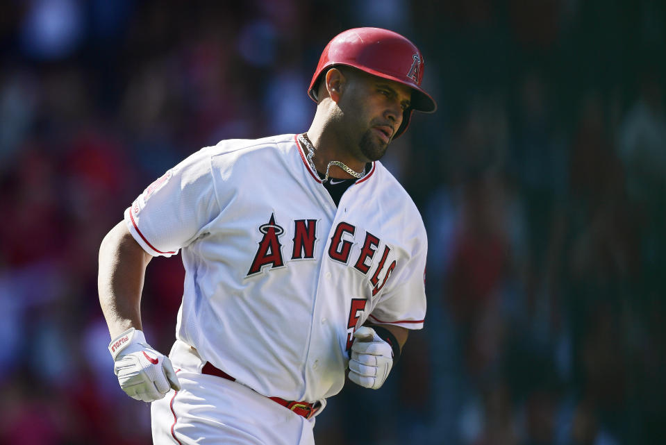 Los Angeles Angels' Albert Pujols rounds first after hitting a solo home run during the seventh inning of a baseball game against the Texas Rangers Saturday, April 6, 2019, in Anaheim, Calif. (AP Photo/Mark J. Terrill)