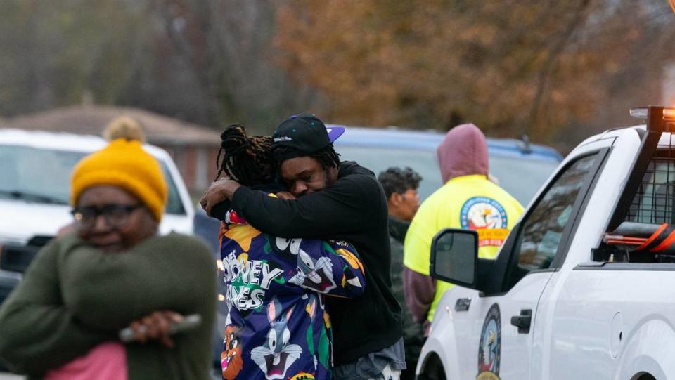 Mourners gather at the scene of an apparent murder-suicide in Cahokia Heights on Nov. 21, 2023.