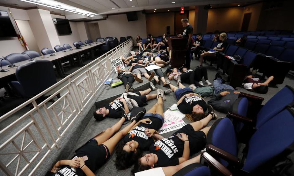 Survivors from Marjory Stoneman Douglas high school lie down on the floor at the approximate time of the attack one week ago. 
