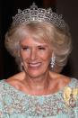 <p>The Greville tiara was made by Boucheron for Dame Margaret Helen Greville in 1920. It is also known as the Boucheron Honeycomb tiara, and is worn here by Camilla, Duchess of Cornwall. Greville left the tiara to the Queen Mother when she died in 1942, and upon the death of the Queen Mother in 2002, the Queen inherited the headpiece. It is now one of three tiaras on long-term loan to Camilla, who married Prince Charles in 2005. </p>