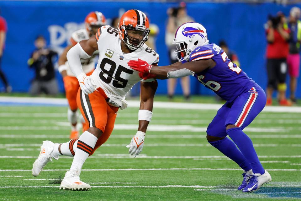 Buffalo Bills running back Devin Singletary (26) blocks Cleveland Browns defensive end Myles Garrett (95) in the second half during an NFL football game, Sunday, Nov. 20, 2022, in Detroit. (AP Photo/Rick Osentoski)