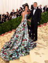 <p>Amal – wearing British designer Richard Quinn – and George took to the cream carpet for the 2018 Met Gala together. <em>[Photo: Ian West/PA Wire]</em> </p>