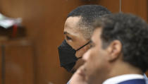 Eric Holder, left looks on with his attorney during closing arguments at his trial for the 2019 first-degree murder of the 33-year-old hip-hop star Nipsey Hussle on Thursday, June 30, 2022, in Los Angeles. (Frederic J. Brown/Pool Photo via AP)