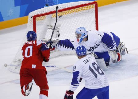 Ice Hockey – Pyeongchang 2018 Winter Olympics – Men Preliminary Round Match – Czech Republic v South Korea - Gangneung Hockey Centre, Gangneung, South Korea – February 15, 2018 - Czech Republic's Roman Cervenka (L) shoots over the net during the first period. REUTERS/Brian Snyder