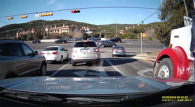 A Texas intersection on Friday, just seconds before a red truck failed to stop. Photo: Youtube/Glen Bandel