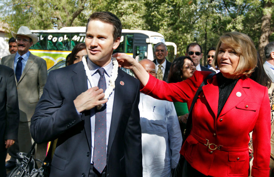 FILE PHOTO: U.S. Republican lawmakers Cynthia Lummis (in red) and Aaron Schock (wearing a garland) arrive at the Gandhi Ashram in the western Indian city of Ahmedabad March 28, 2013. REUTERS/Amit Dave/File Photo