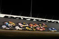 DAYTONA BEACH, FL - FEBRUARY 18: Tony Stewart, driver of the #14 Office Depot/Mobil 1 Chevrolet, and Kyle Busch, driver of the #18 M&M's Brown Toyota, lead a pack during the NASCAR Budweiser Shootout at Daytona International Speedway on February 18, 2012 in Daytona Beach, Florida. (Photo by Jared C. Tilton/Getty Images for NASCAR)